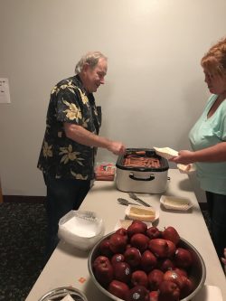Volunteer Serves Food at Newport Elks Club Event 